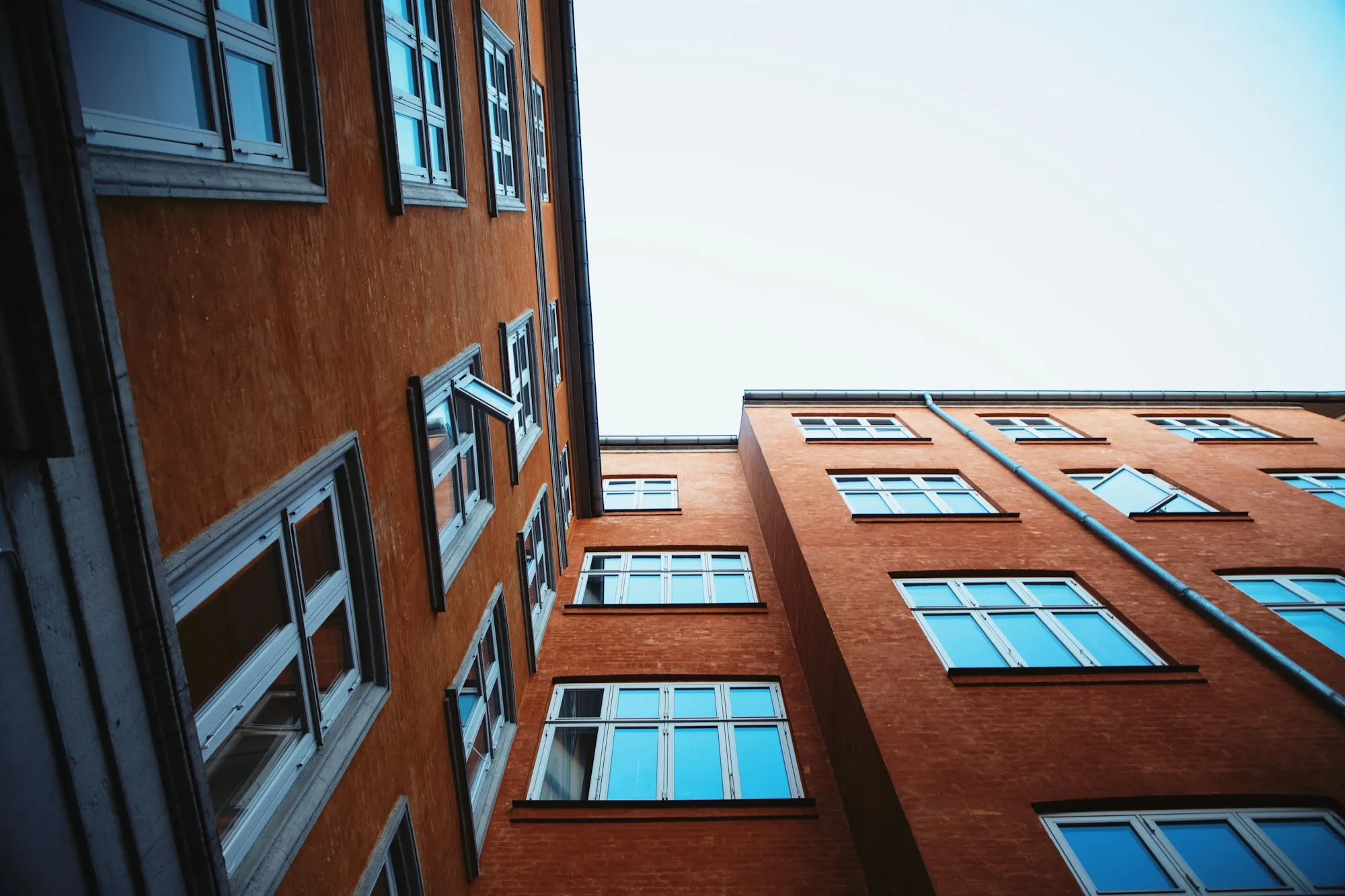 Red brick commercial building viewed from below