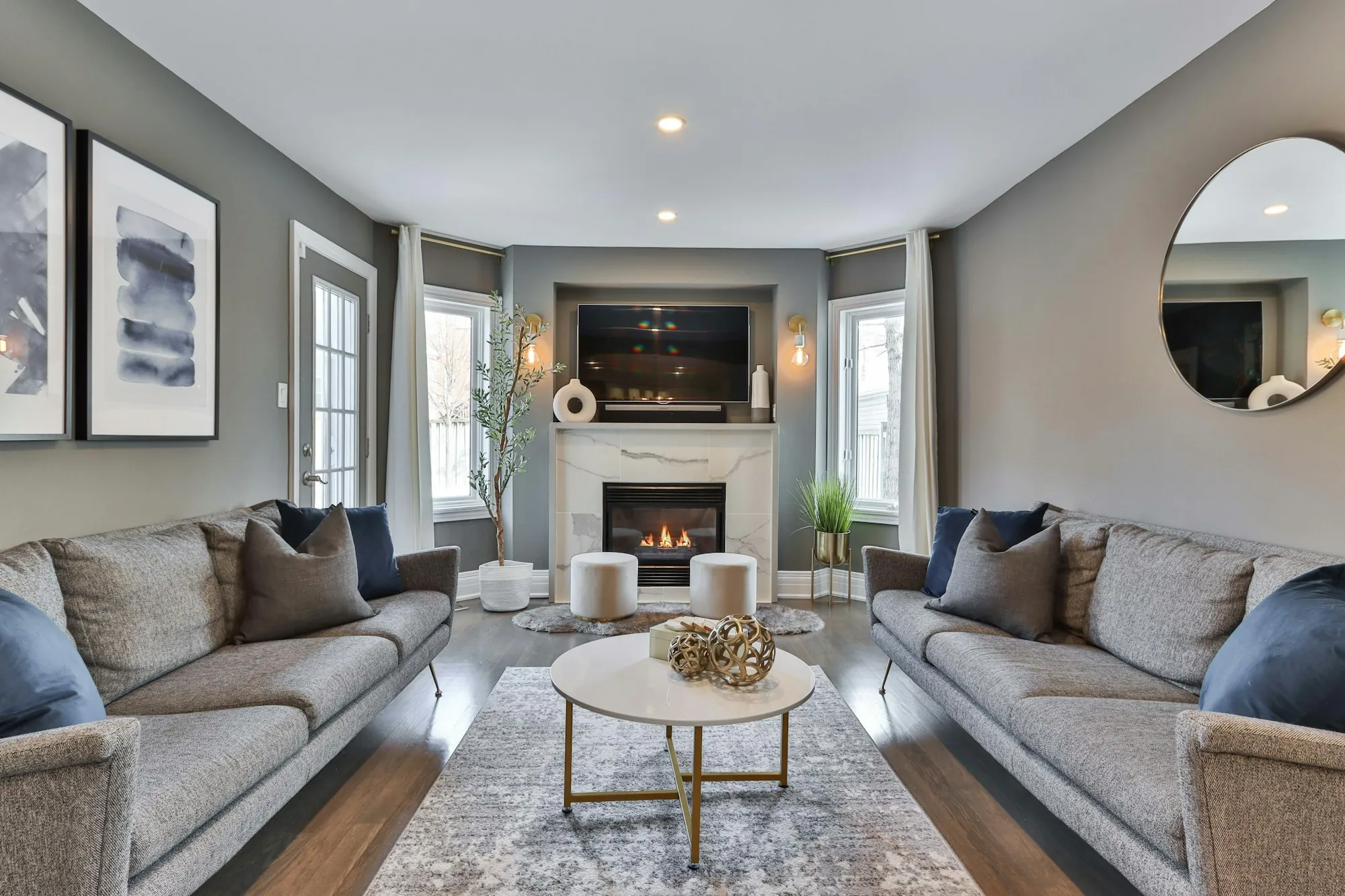 Living room with matching sofas and a fireplace